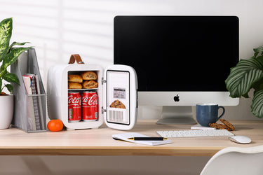 Subcold Pro 4 litre grey mini fridge with snacks and drinks inside